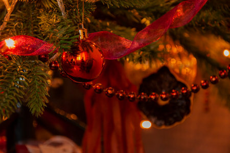 Christmas tree decoration. Happy New Year. Xmas holiday celebration. New Year eve. December holiday and home decoration. Decorated Xmas tree at home. Cozy winter evening.の写真素材