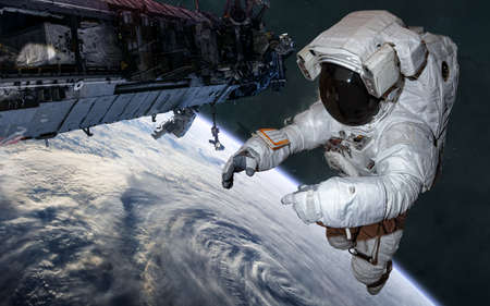 Astronaut  in orbit of Earth. Solar system. Science fiction.
