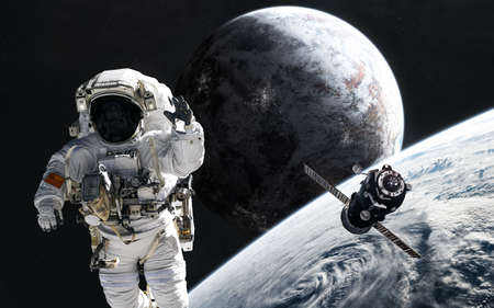 Astronaut and orbital station in stratosphere of deep space planet. Science fiction.の写真素材