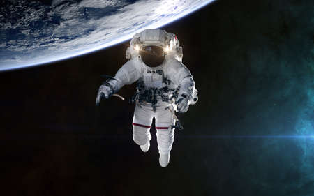 Astronaut orbiting planet Earth. Solar system. Science fiction.
