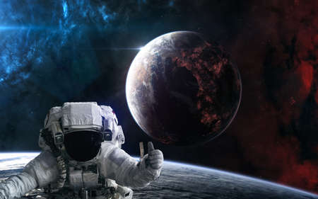Astronaut in outer space. Inhabited planet of deep space. Science fiction.の写真素材