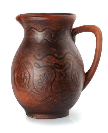 clay jug with ornament isolate on whiteの写真素材