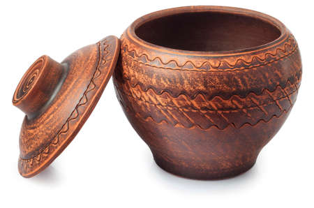 one empty clay pot for cooking with open cap isolated on whiteの写真素材
