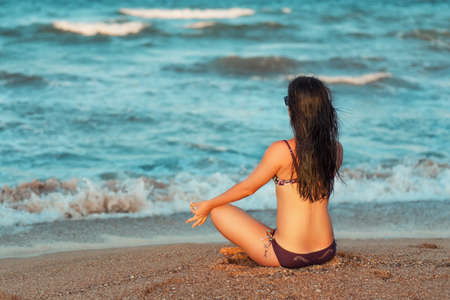 Yoga meditation on beachの写真素材