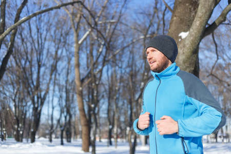 young man running in winter