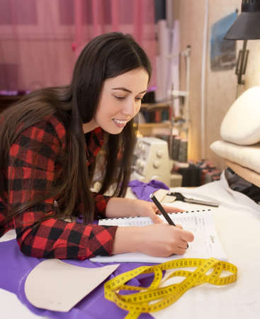 fashion designer writes notesの写真素材