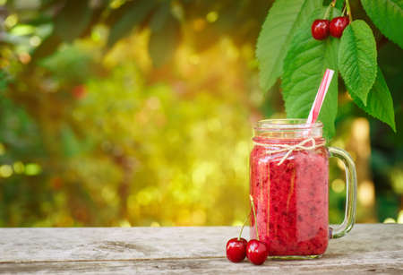 mason jar with cherry smoothieの写真素材