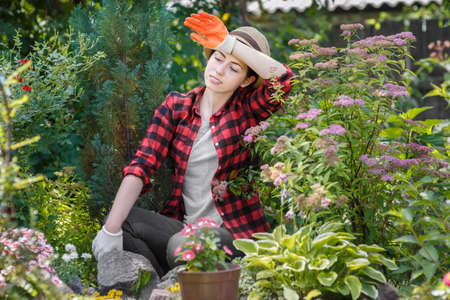 tired young woman gardener