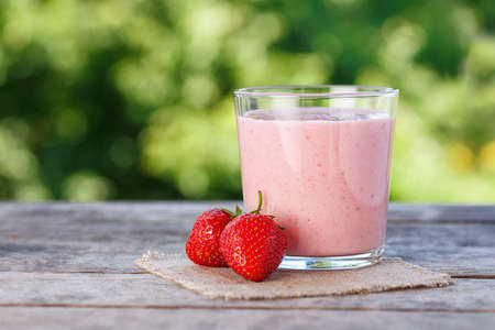 strawberry smoothie on natural backgroundの写真素材