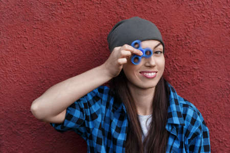 girl playing with fidget spinnerの写真素材