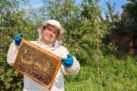 beekeeper with honeycombの写真素材