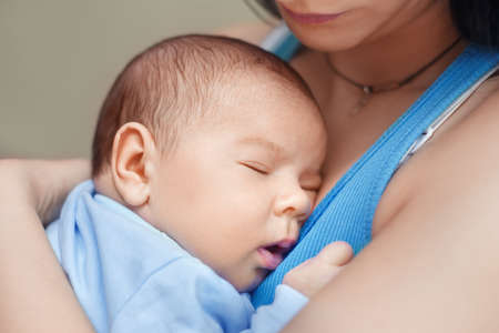 mother holding newborn baby