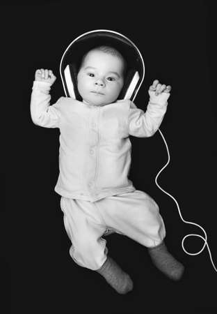 newborn with headphonesの写真素材