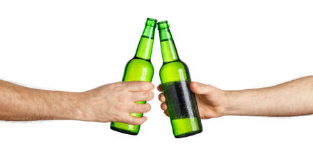 beer bottles making toastの写真素材