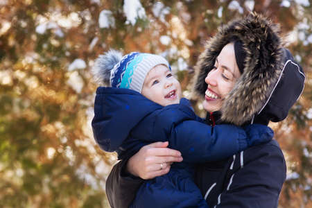 mother and baby on winter walkの写真素材