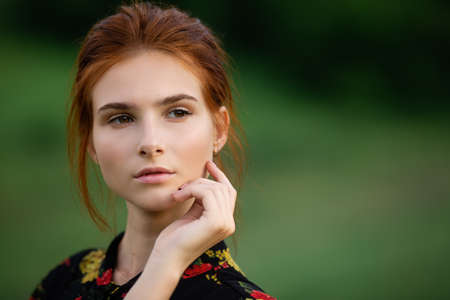 outdoors portrait of beautiful young womanの写真素材