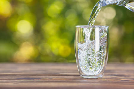water pouring into glassの写真素材