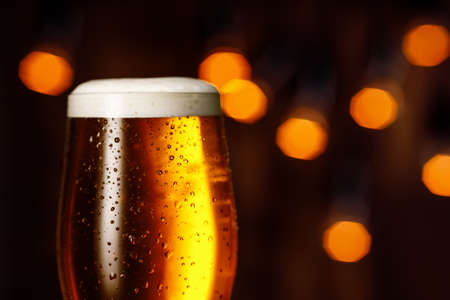 glass of beer with foam and bubblesの写真素材