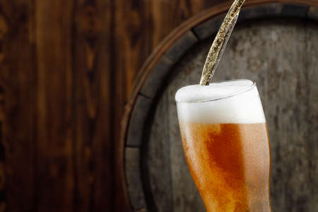 beer pouring into glassの写真素材