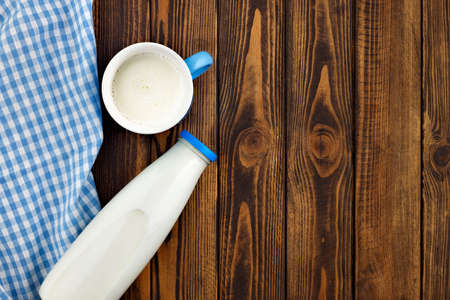 milk in glass bottle and cupの写真素材