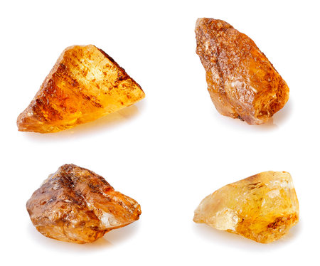 set of brown caramelized sugar lumps isolated on whiteの写真素材