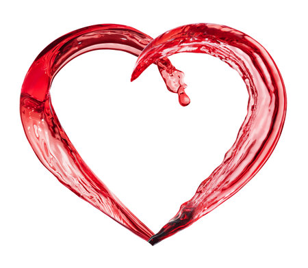 heart splash from red wine or juice isolated on whiteの写真素材