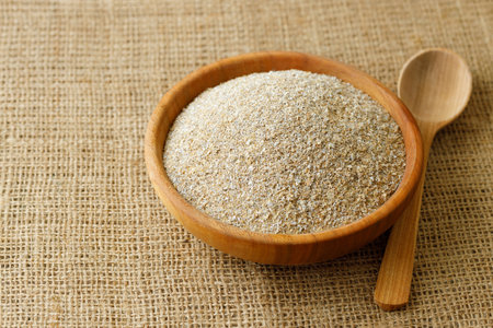 rye bran in bowl on table with burlapの写真素材