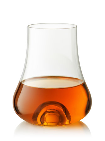 Glass of scotch whiskey or brandy on white background with clipping pathの写真素材