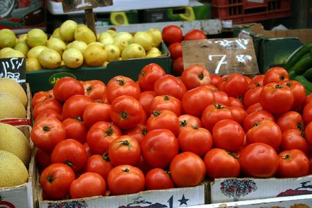 ripe tomatoes on the counter marketの写真素材