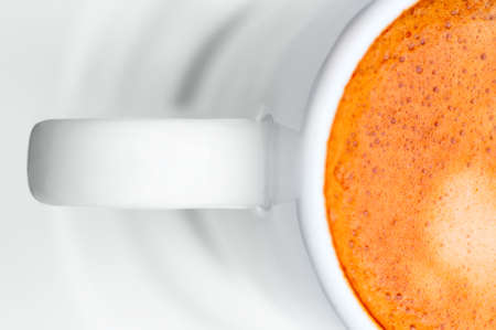 Macro close up studio shot of a half cup of espresso coffeeの写真素材