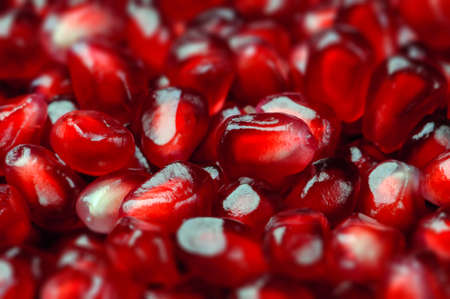 Pomegranate seeds close up macro studio shot