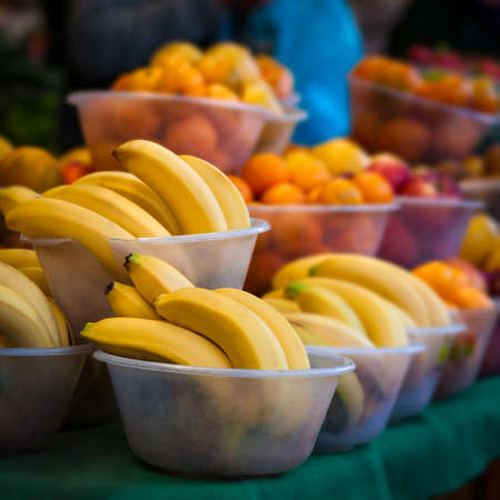 Outdoor farmer s market selling fruit in bowlsの写真素材
