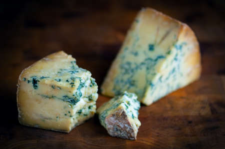 Stilton mature blue mouldy cheese - Dark backgroundの写真素材