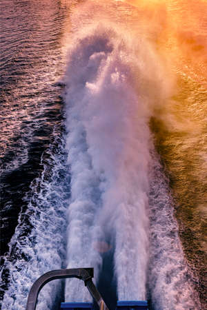Ferry engine spray sunset time powerful enginesの写真素材