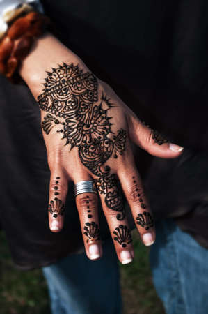 Henna tatto on woman's hand trendy floral designの写真素材