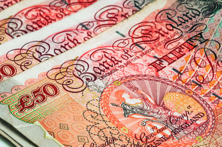Closeup macro view at UK currency fifty pound banknote