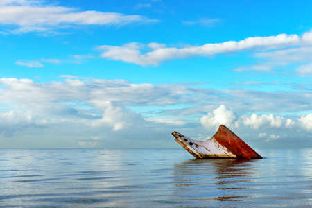Ship wreck rusty landscape sinking into the sea Trinidad and Tobagoの写真素材