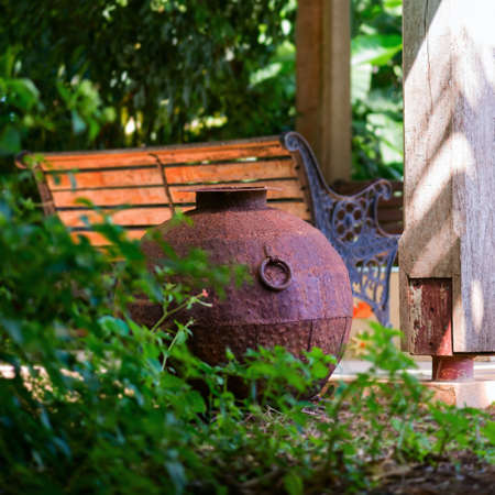 Decorative iron metal pot by gazebo relaxing space environment garden zen design squareの写真素材