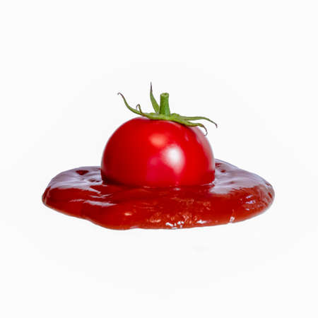 Ketchup tomato puree sauce plum on top white backgroundの写真素材