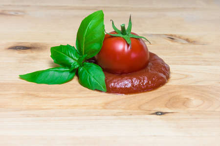 Ketchup cuncept tomato puree basil board ingredients italian sauceの写真素材