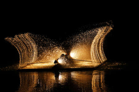 lit fountains in the nightの写真素材