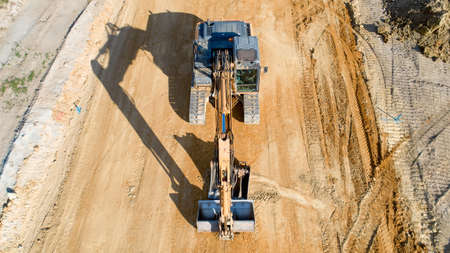 Aerial photo of a backhoe on a construction site