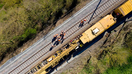 Aerial view of workers on a railway construction siteの写真素材