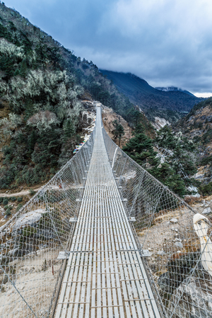 Famous suspension bridge on the way to the base camp of Everest, the Himalayas, Nepal.の写真素材