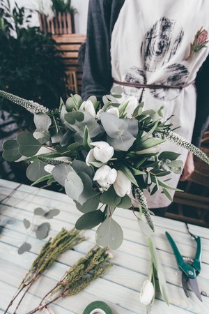 Florist shop with workplace on making flower bouquetの写真素材