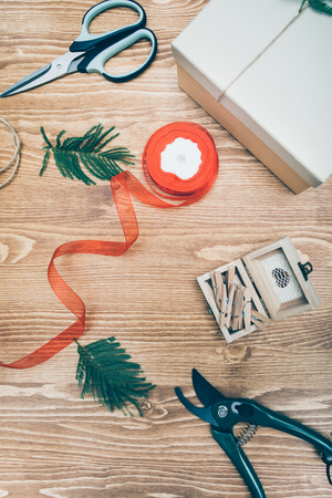 Flat lay of working counter of florist with ribbons and decor for arranging bouquets.の写真素材