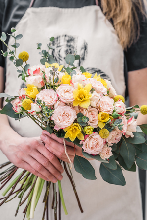 Professional crop artist showing tender blooming bunch of flowers. の写真素材