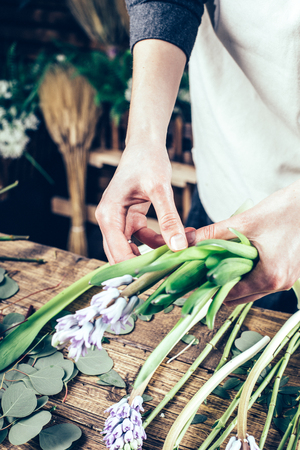 Florist working on the workspace in flower shop tの写真素材