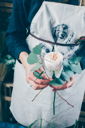 Florist at work on arragment flower bouquetの写真素材