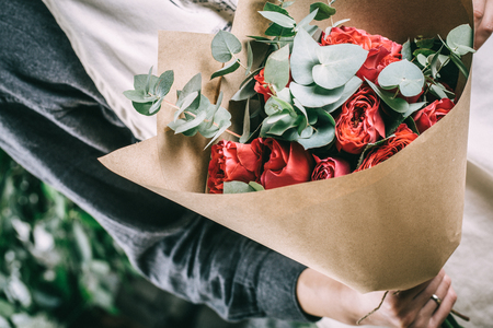 Red rose in brides flower bouquetの写真素材